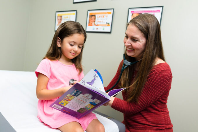 Bluestem Health Pediatrician, Dr. Erica Peterson, with young patient
