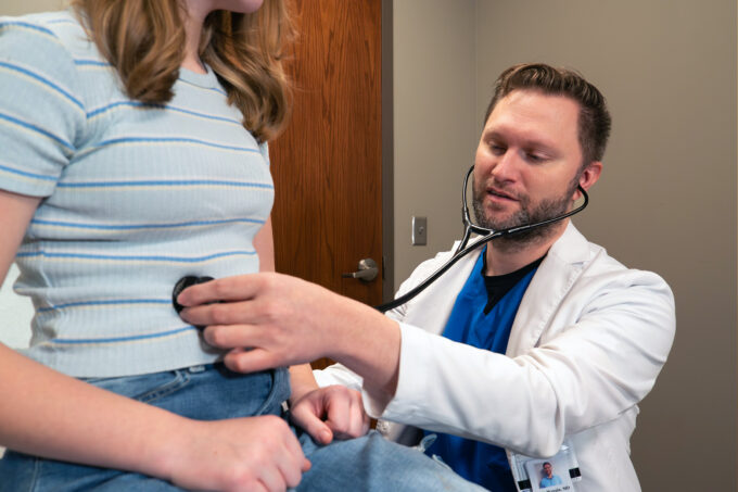 Brett Wergin, MD, with patient at Bluestem Health