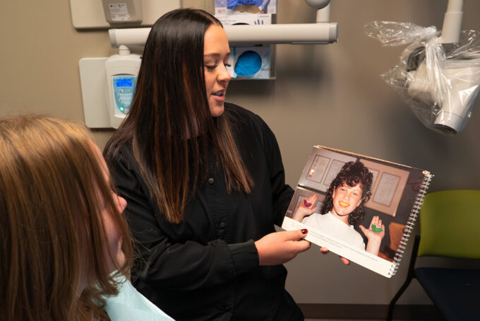 dental hygienist giving youth patient exam at Bluestem Health